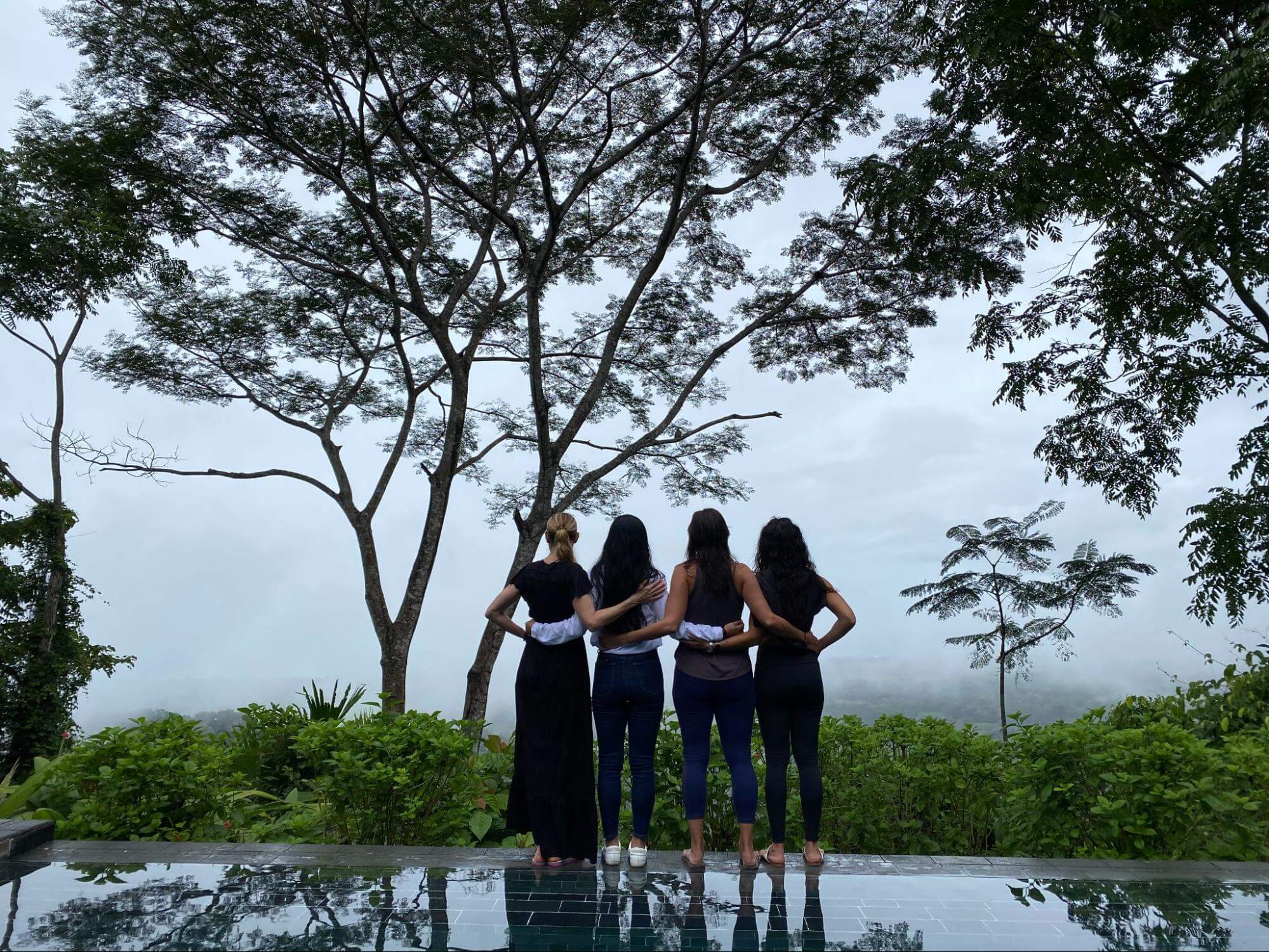 Four Women in nature and arm in arm